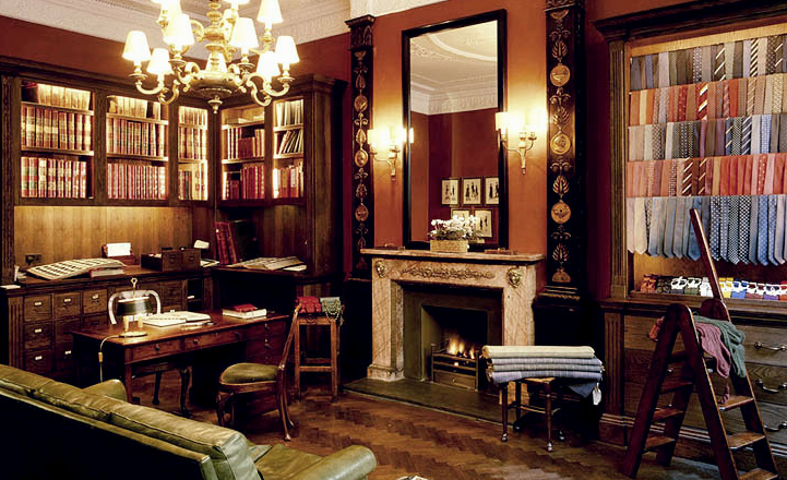 Traditional craft workshop interior, wooden worktables, hand tools and leather goods on display